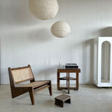 Reclined armchair in canned teak in natural wood