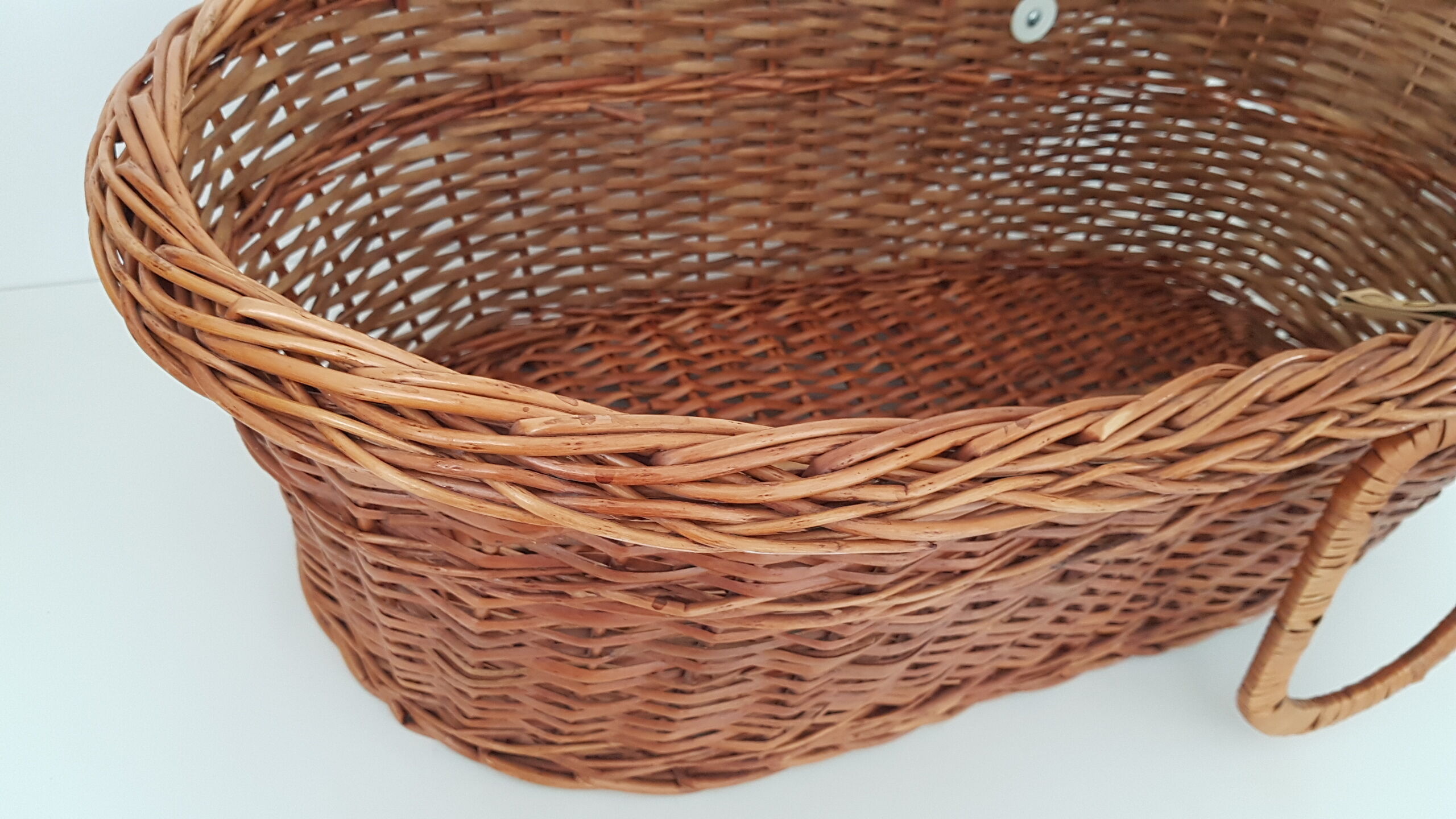 Old rattan bassinet and bedding