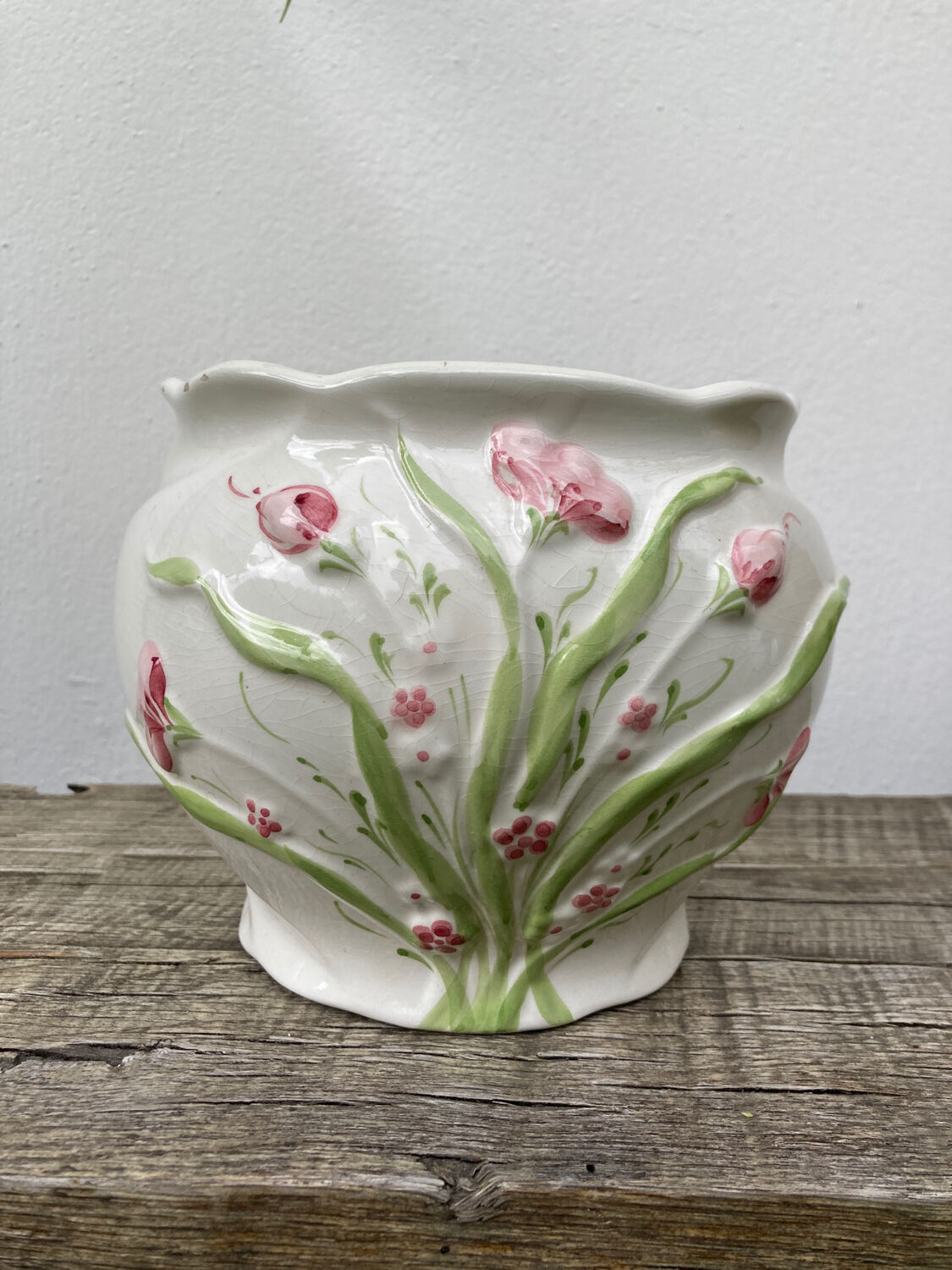 White ceramic pot cache in old flower slip