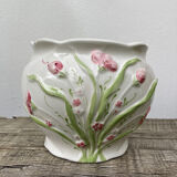 White ceramic pot cache in old flower slip