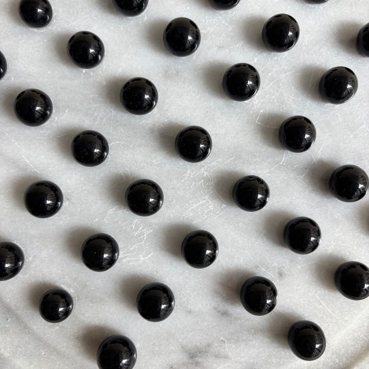 Marble and stone tic-tac-toe games