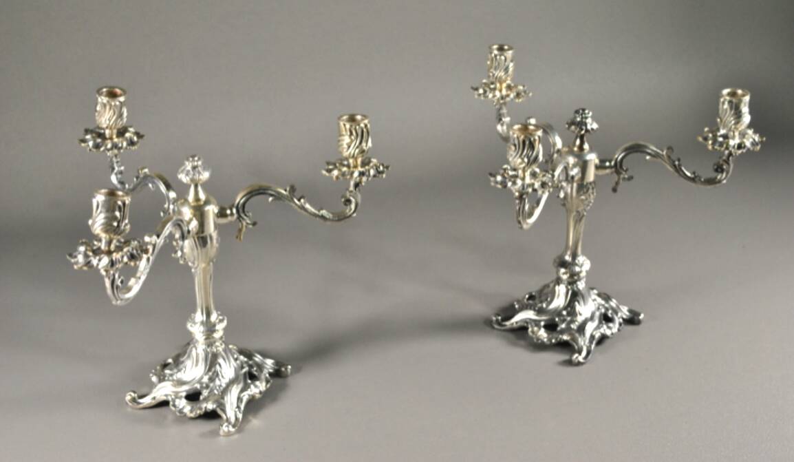 Pair of three-armed silver-plated metal candelabras