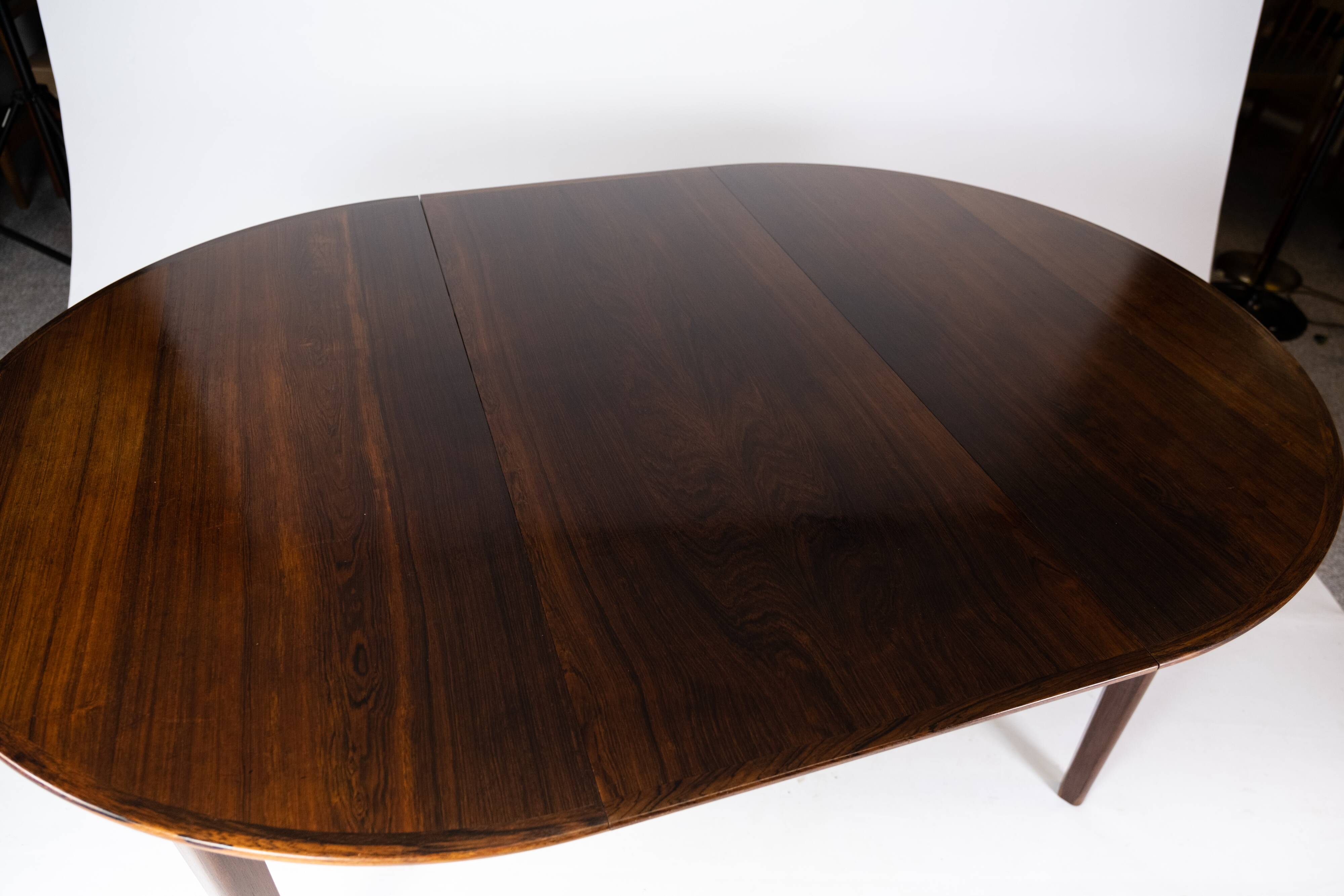 A set of four dining room chairs of teak of danish design, 1960s