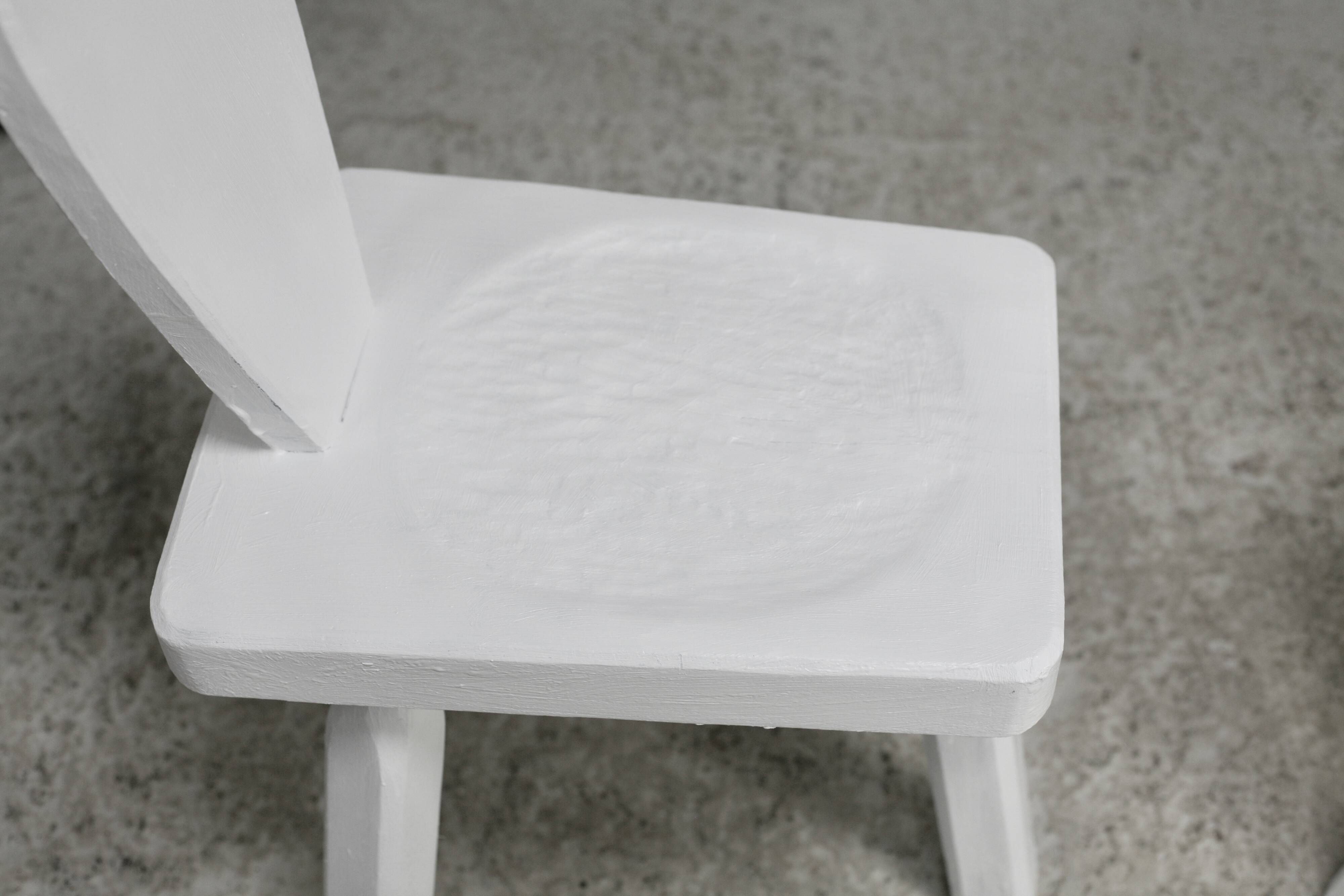 Pair of tripod chairs, gouged seats. Brutalist, circa 1960. Painted wood.