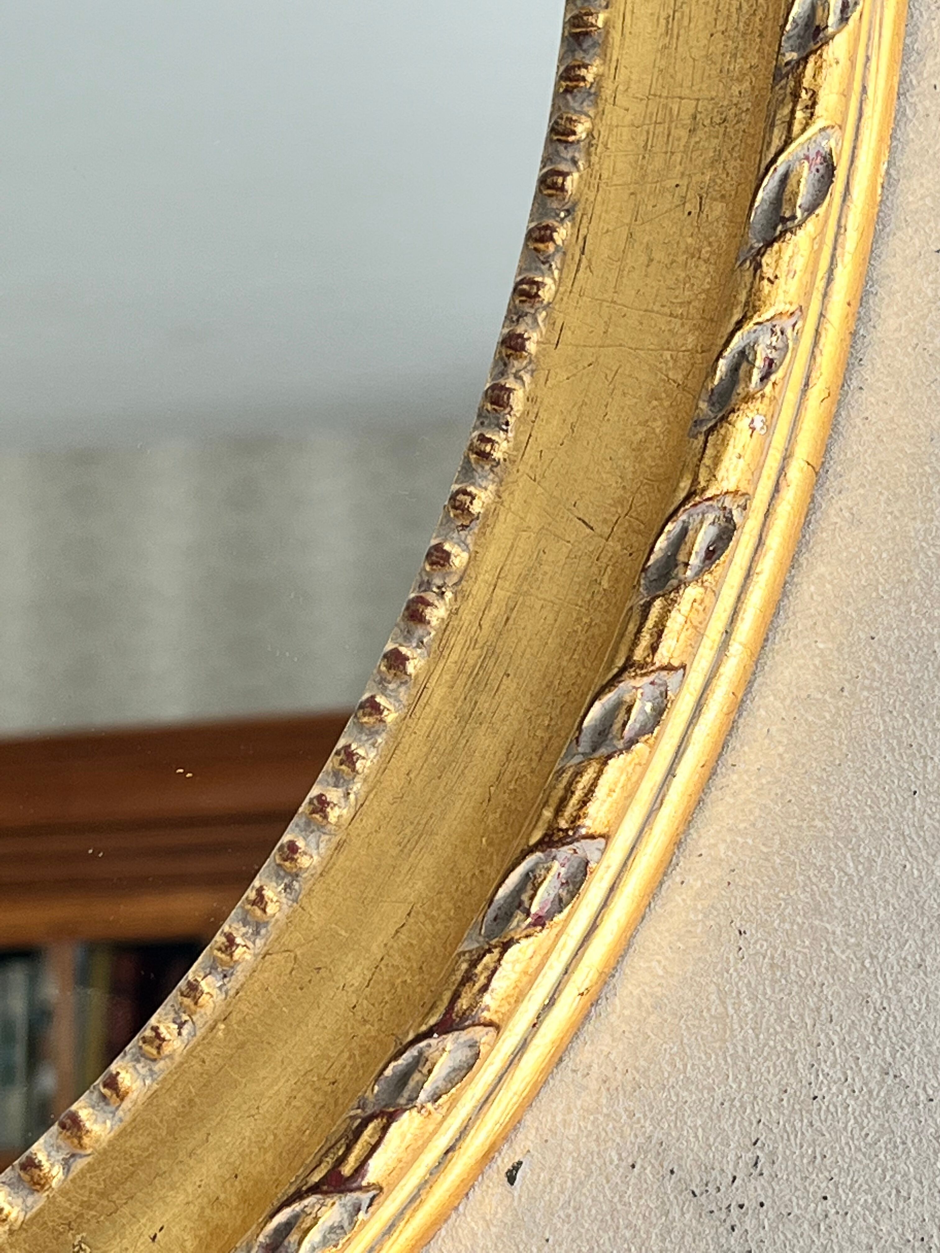 Gilded mirror with pediment