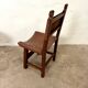 Spanish chair in leather and carved wood, 1950s/60s.