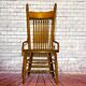 Wooden armchair with high back