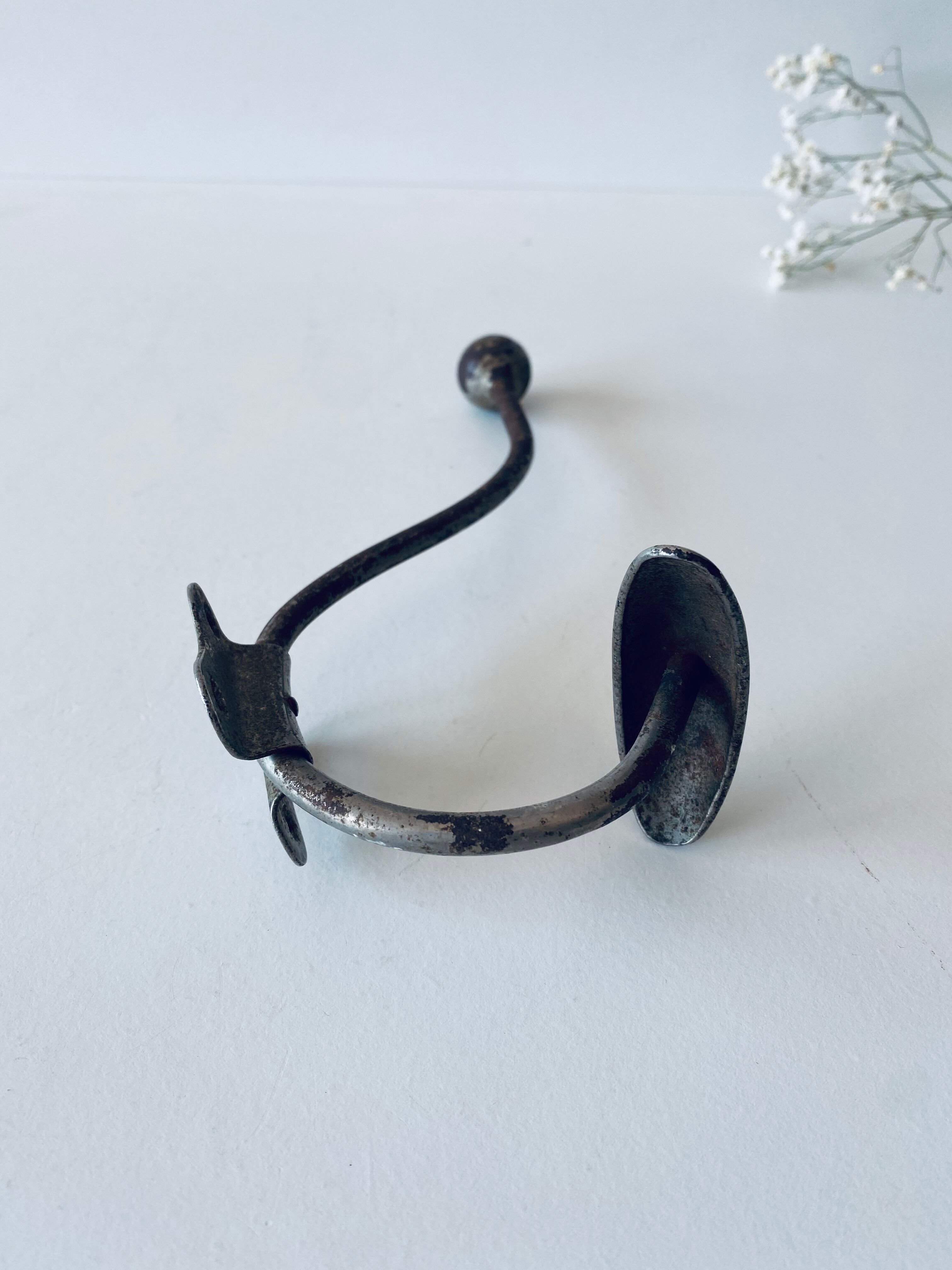 Ancient metal patère