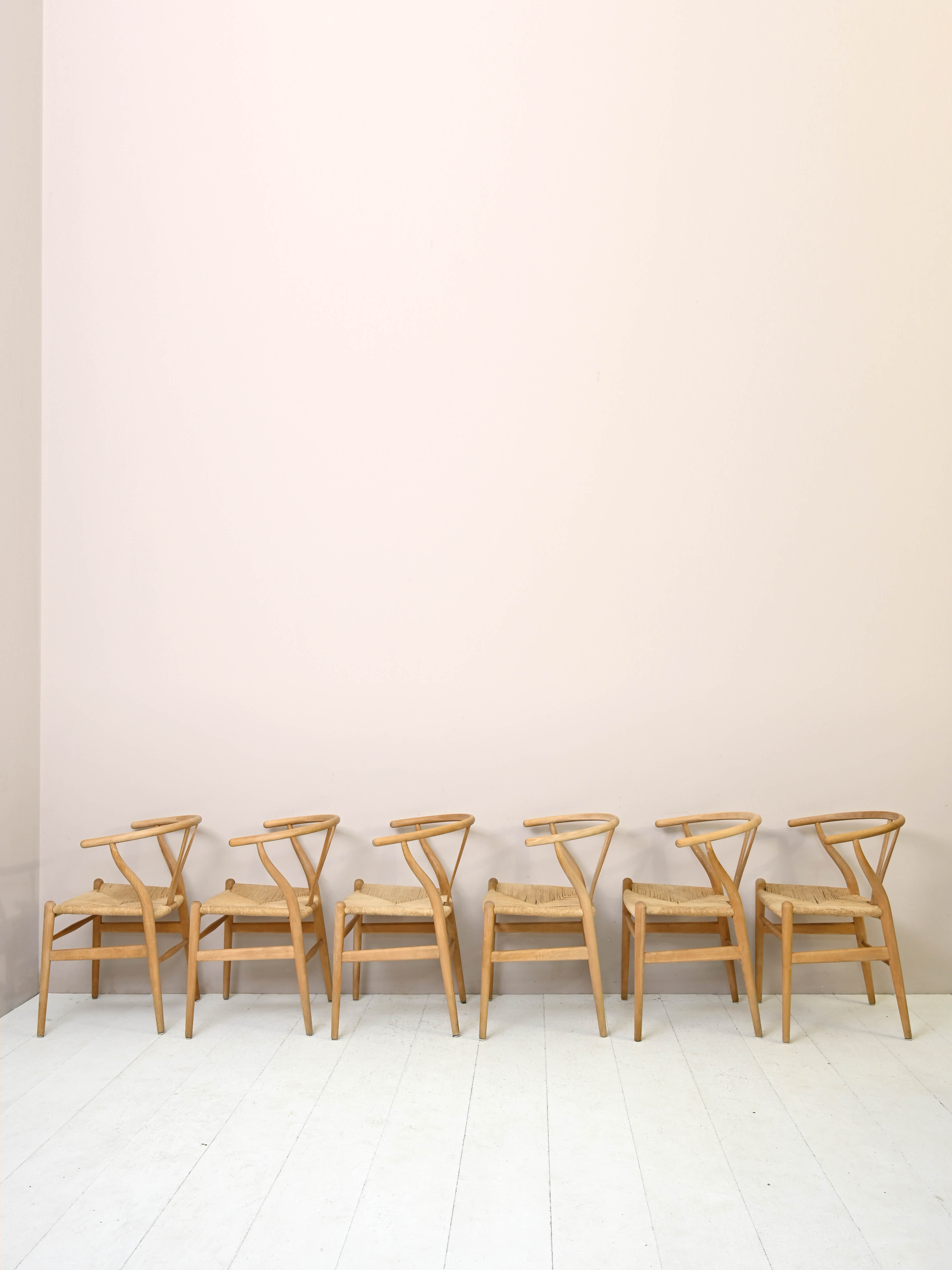 Set of six 'Wishbone chair' model chairs by Hans J. Wegner with leather cushions