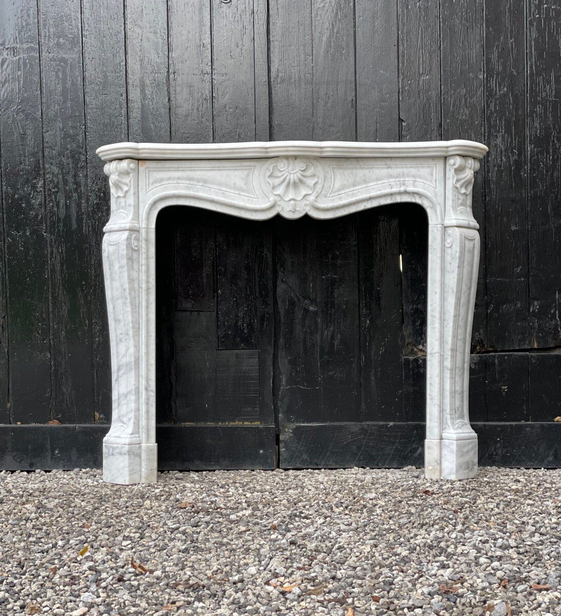 Louis XV style fireplace in Carrara marble
