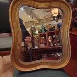 Antique golden quadrilobe-shaped mirror