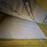 Two yellow Roche Bobois Longislande armchairs.