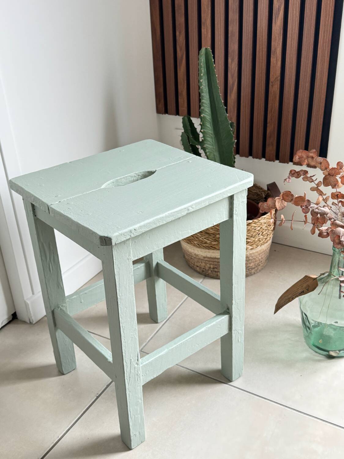 Antique almond green wooden stool