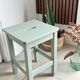 Antique almond green wooden stool