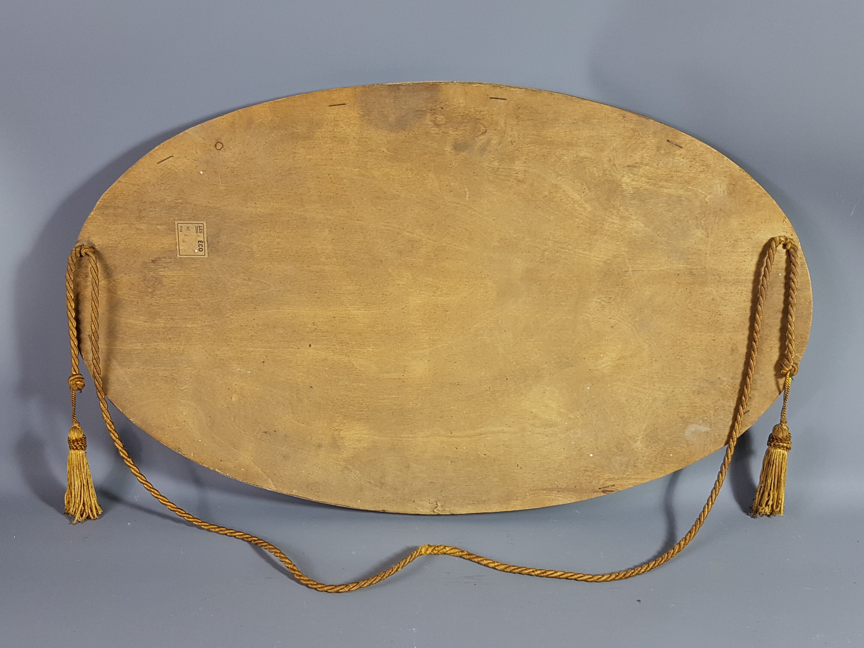 Old bevelled oval mirror with cord and pompoms, 60 x 36 cm