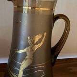 Vintage smoked glass carafe with gold from the 50s/60s, featuring a marine and water skiing design.