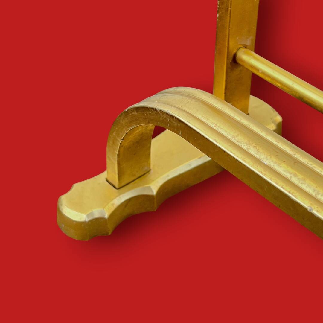 Vintage wall-mounted coat rack in anodised gold aluminium with hat holder.