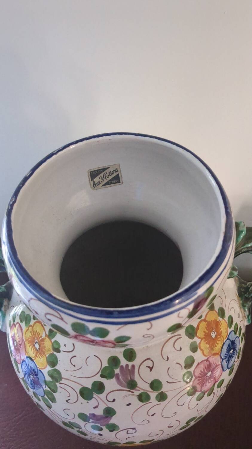 Old porcelain earthenware vase with floral decor