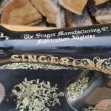 Old Singer sewing machine on pedestal