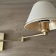 Pair of vintage brass wall lights with adjustable arms.