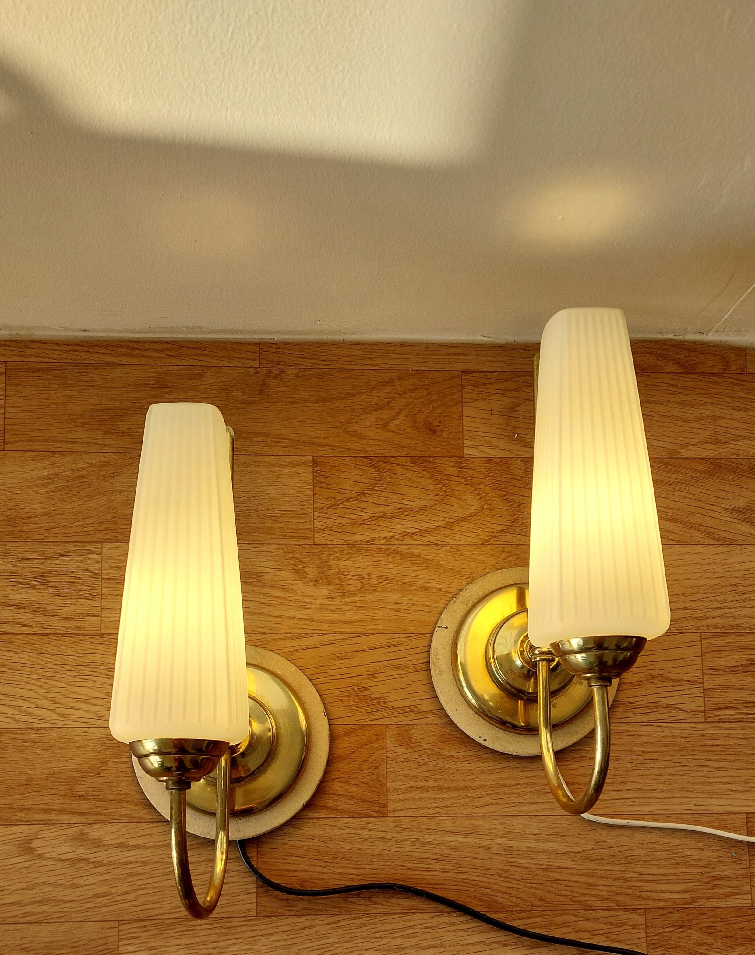 Pair of sconces with a light arm, brass and white opaline 1960.