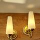 Pair of sconces with a light arm, brass and white opaline 1960.