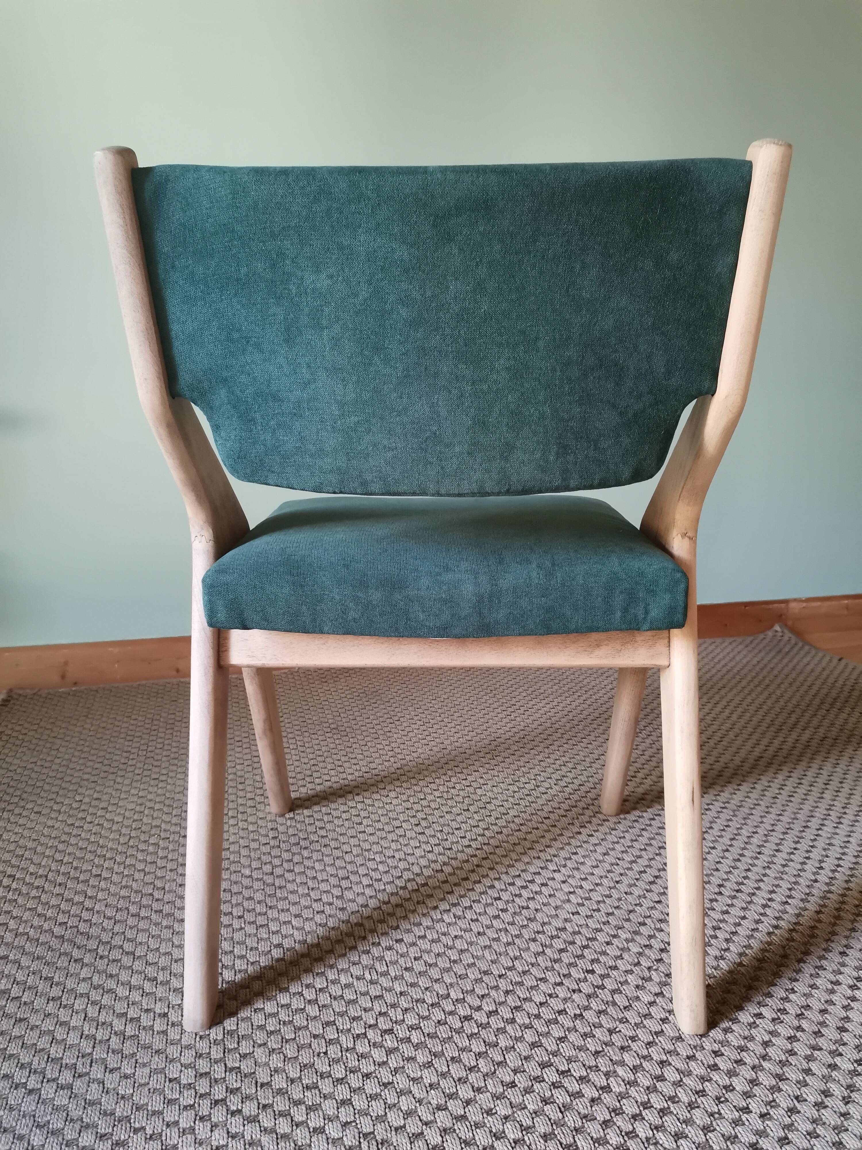 Scandinavian green chairs with tapered legs.