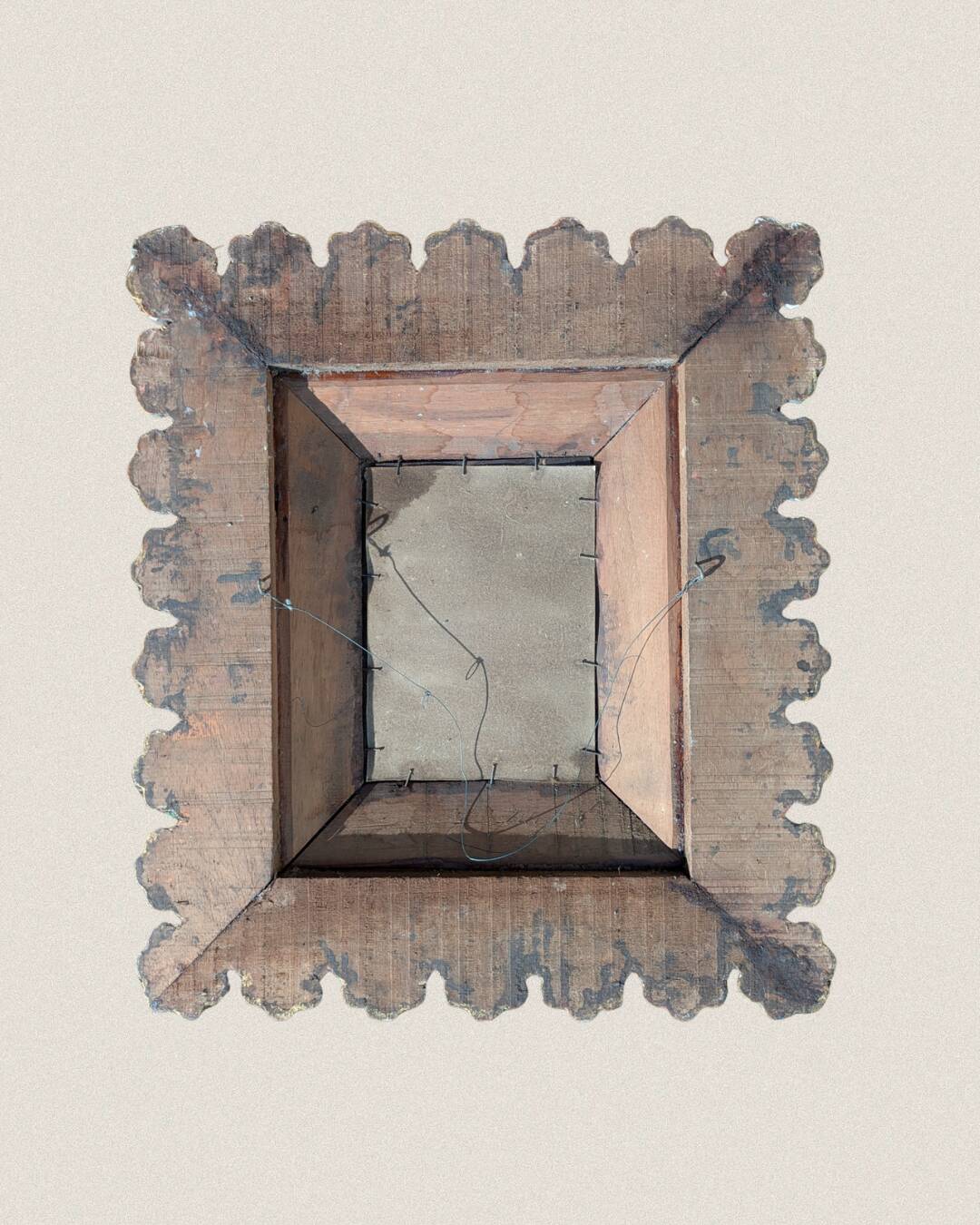 Antique mirror in gilded wood