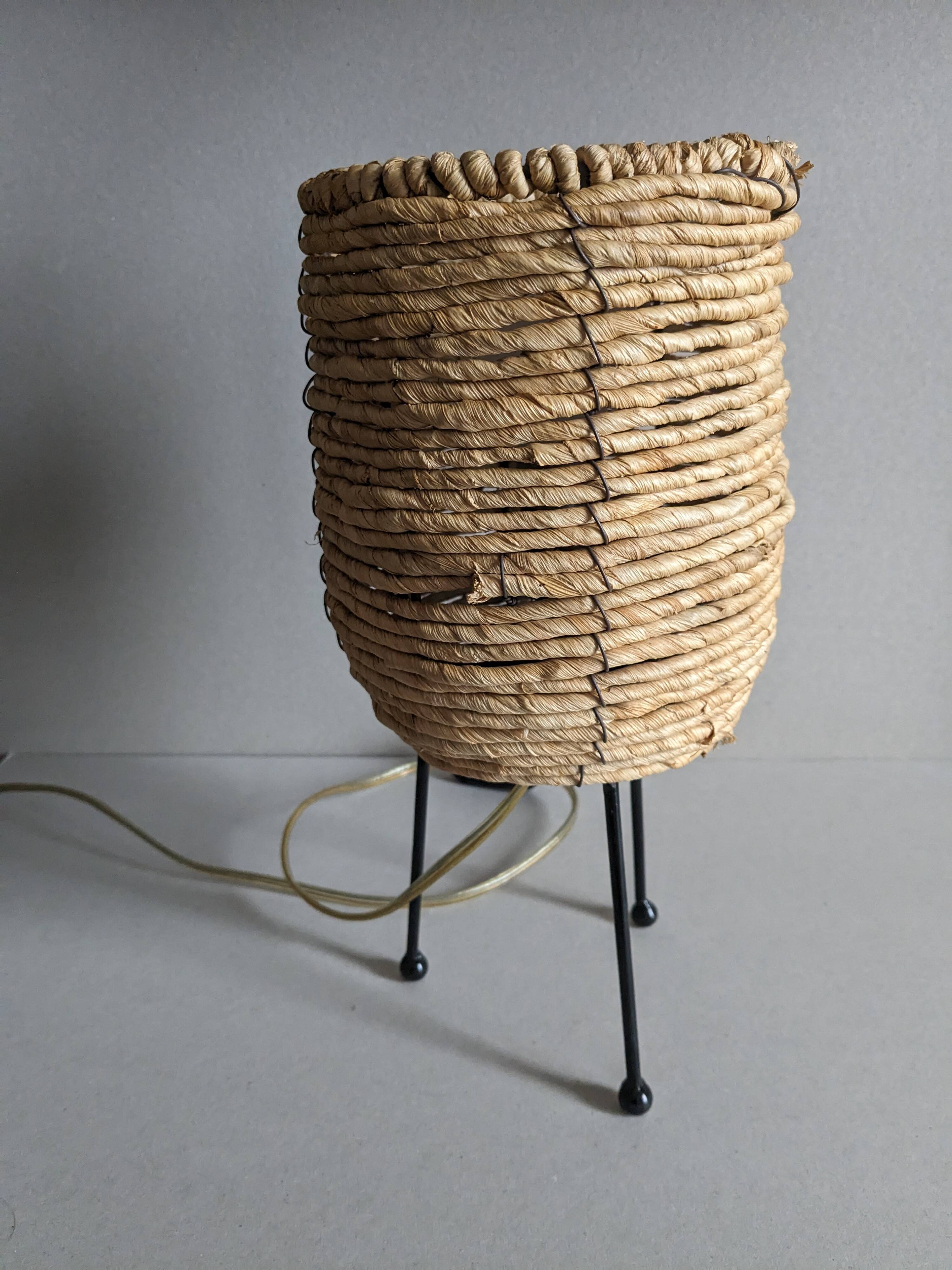 Fiber and metal tripod lamp