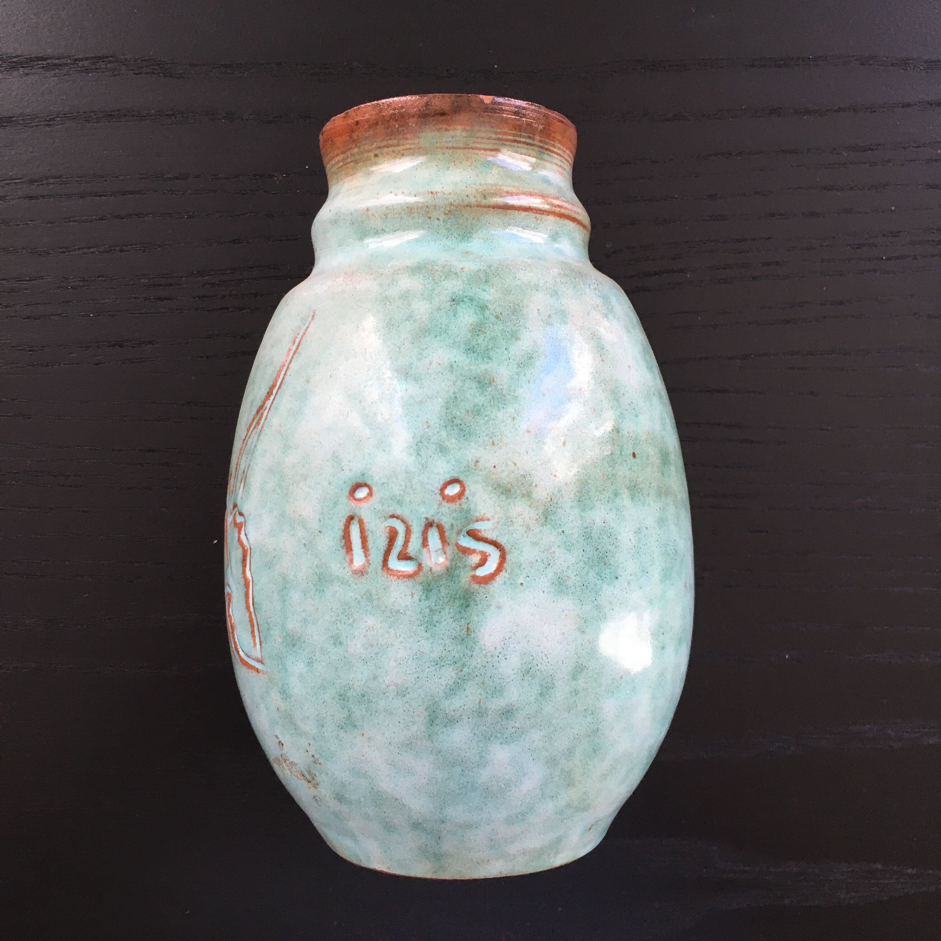 Turquoise vase with iris decoration
