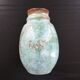 Turquoise vase with iris decoration