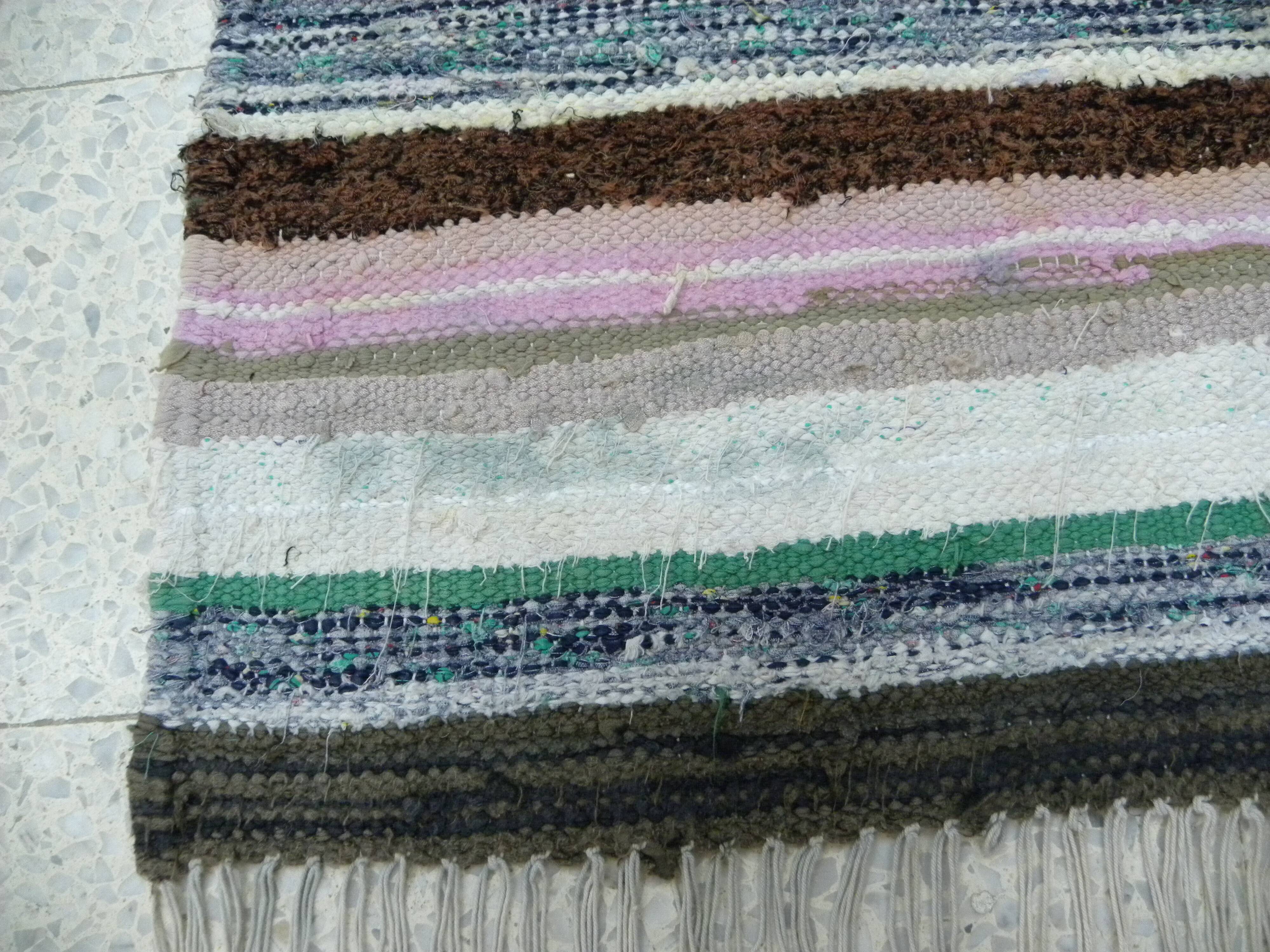 Vintage traditional nomadic kilim ethnic rug with multicoloured stripes.