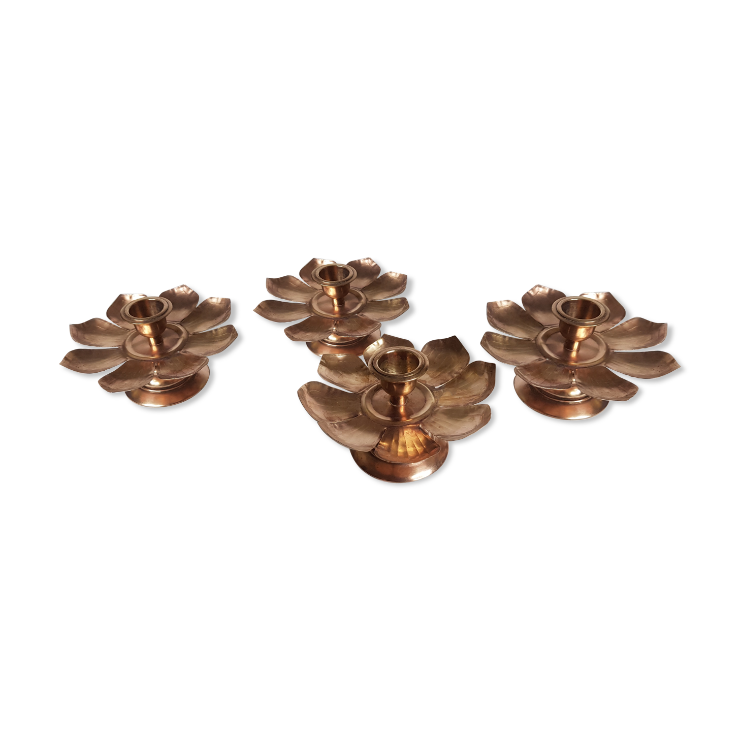Set of four copper candlesticks in the shape of lotus flowers
