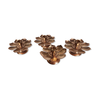 Set of four copper candlesticks in the shape of lotus flowers
