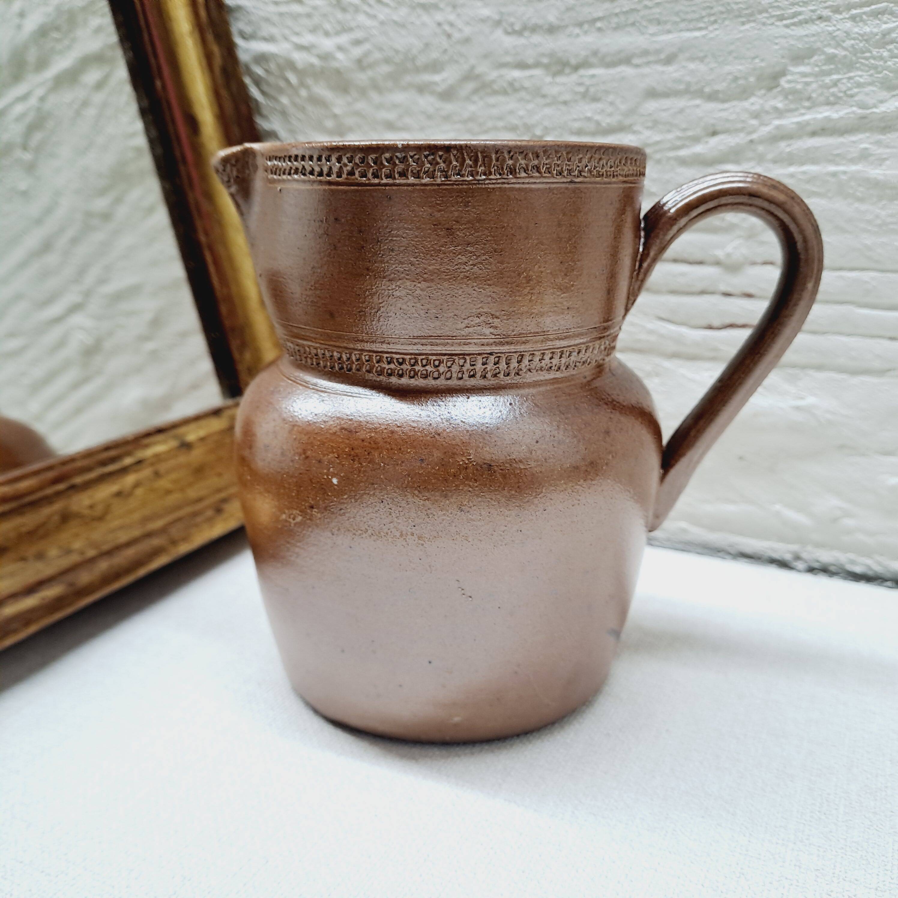 Antique stoneware milk jug
