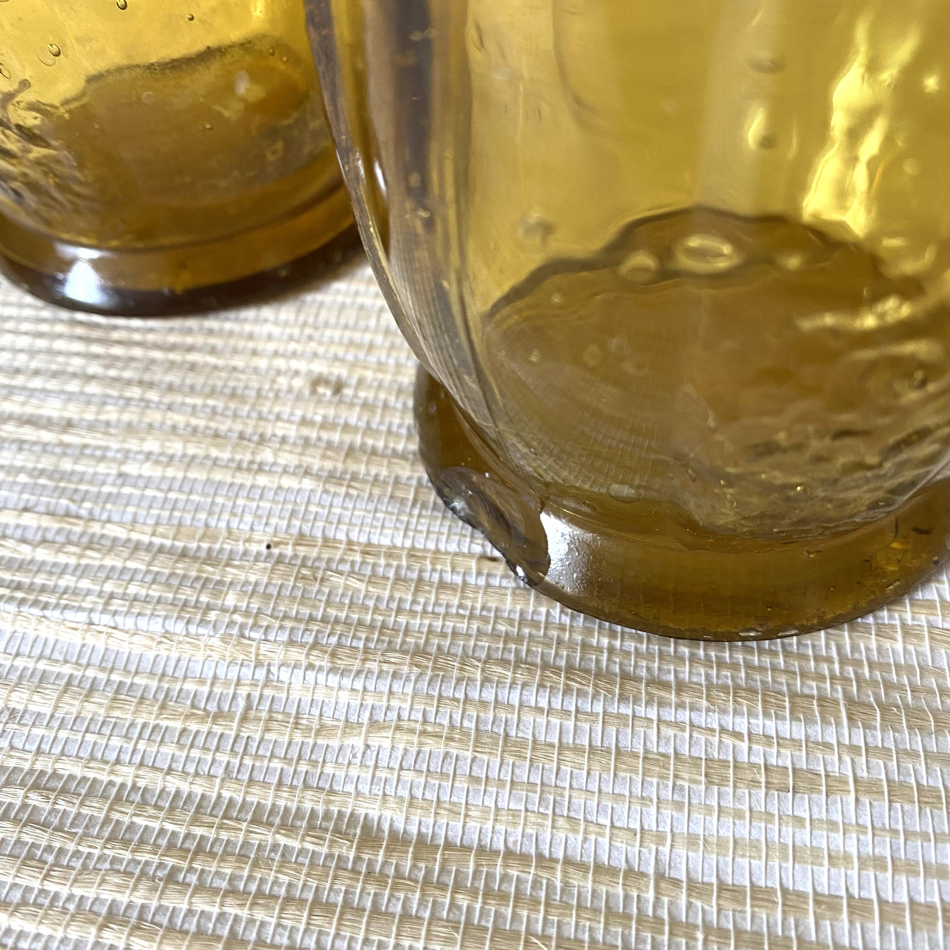 Paire de vases à jacinthe en verre ambré bullé