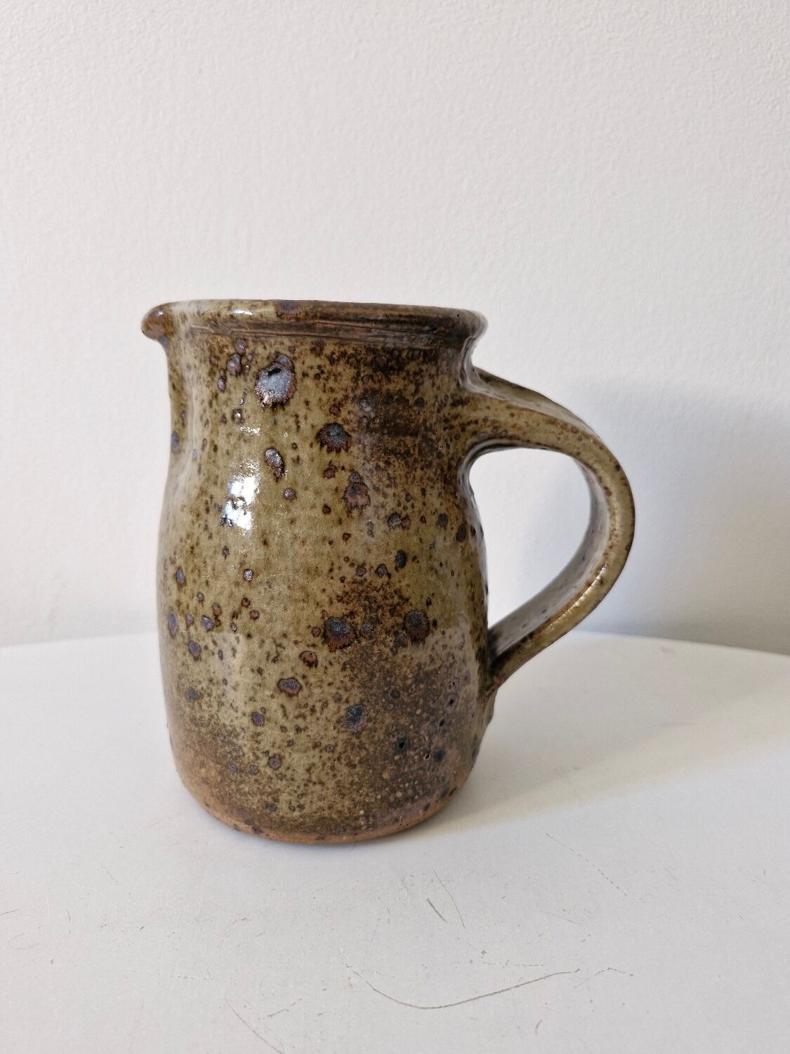 Old pitcher in pyrite stoneware
