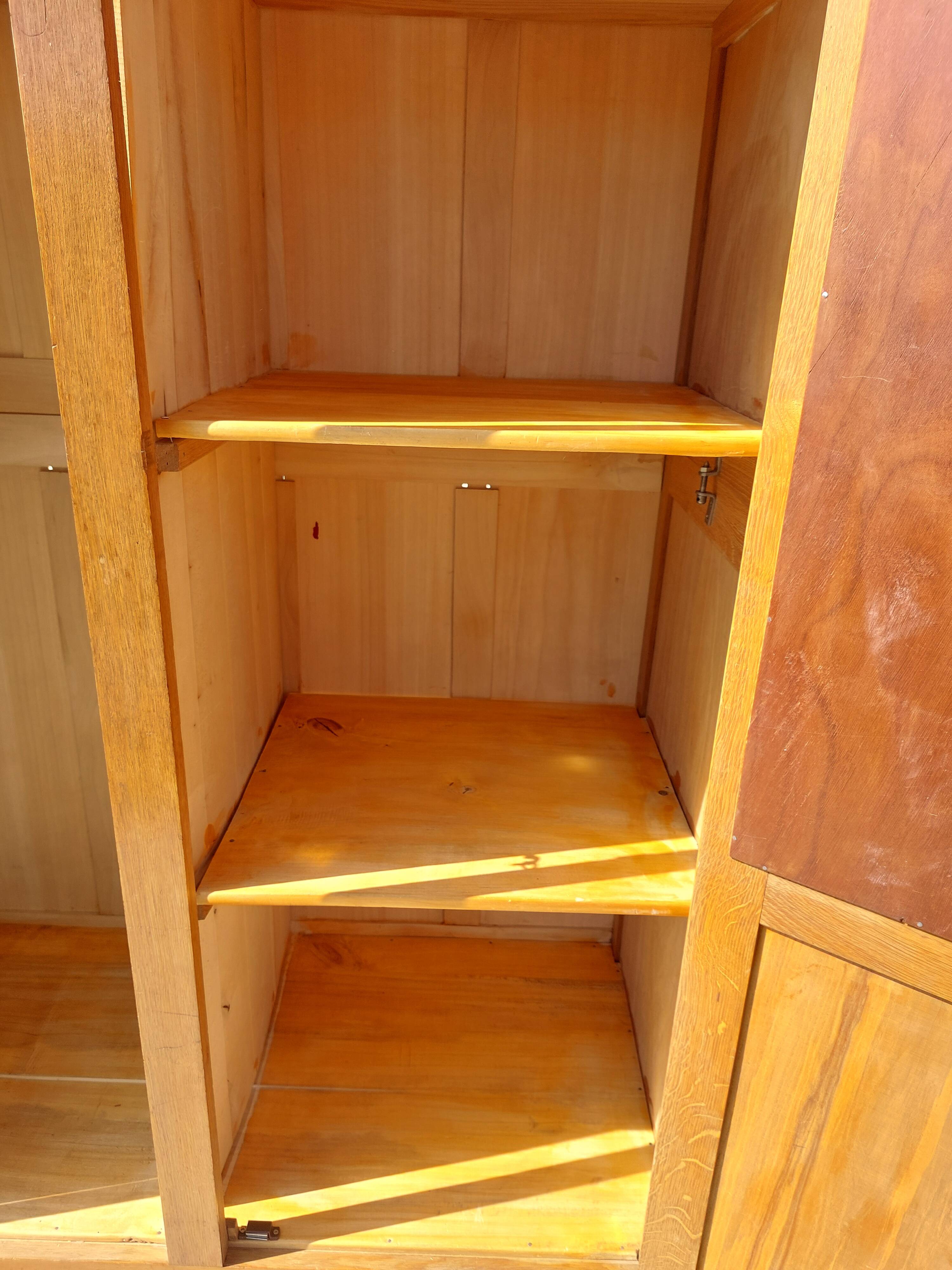 Vintage wardrobe with mirror and tapered legs.