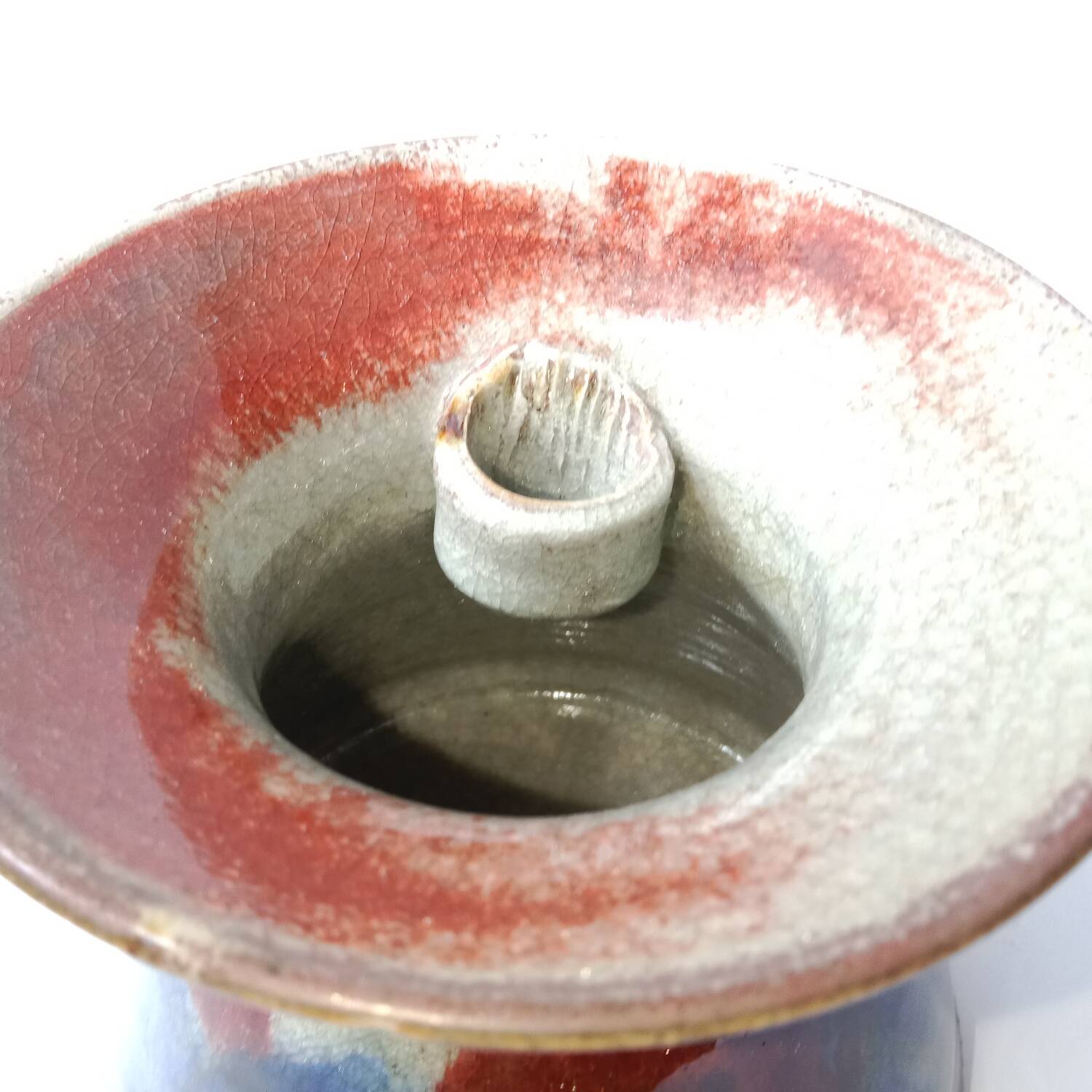 Red and blue glazed stoneware vase signed 12 cm