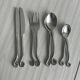 Service for 8 in shiny metal.