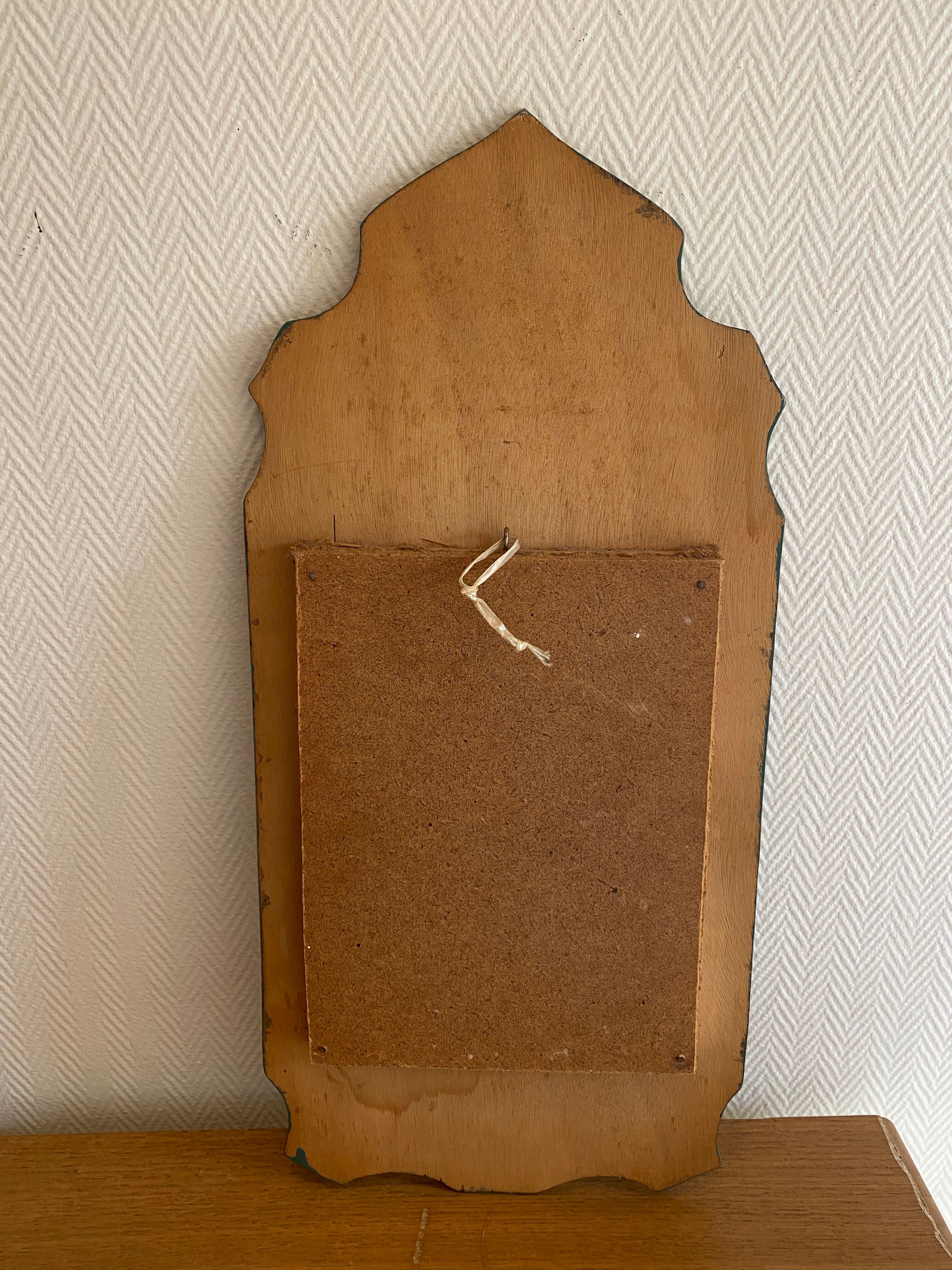 Vintage oriental wall mirror decor under glass