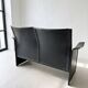 Small vintage black faux leather sofa