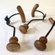 Trio of antique wooden and metal coat hooks