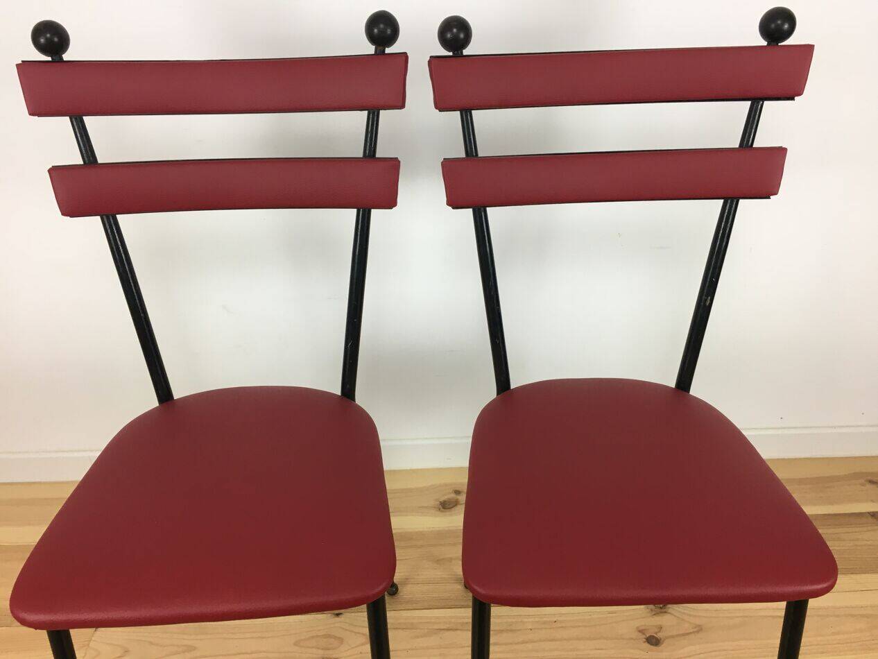 Pair of 1950s chairs in metal and red faux leather, Gueden-Adnet style.
