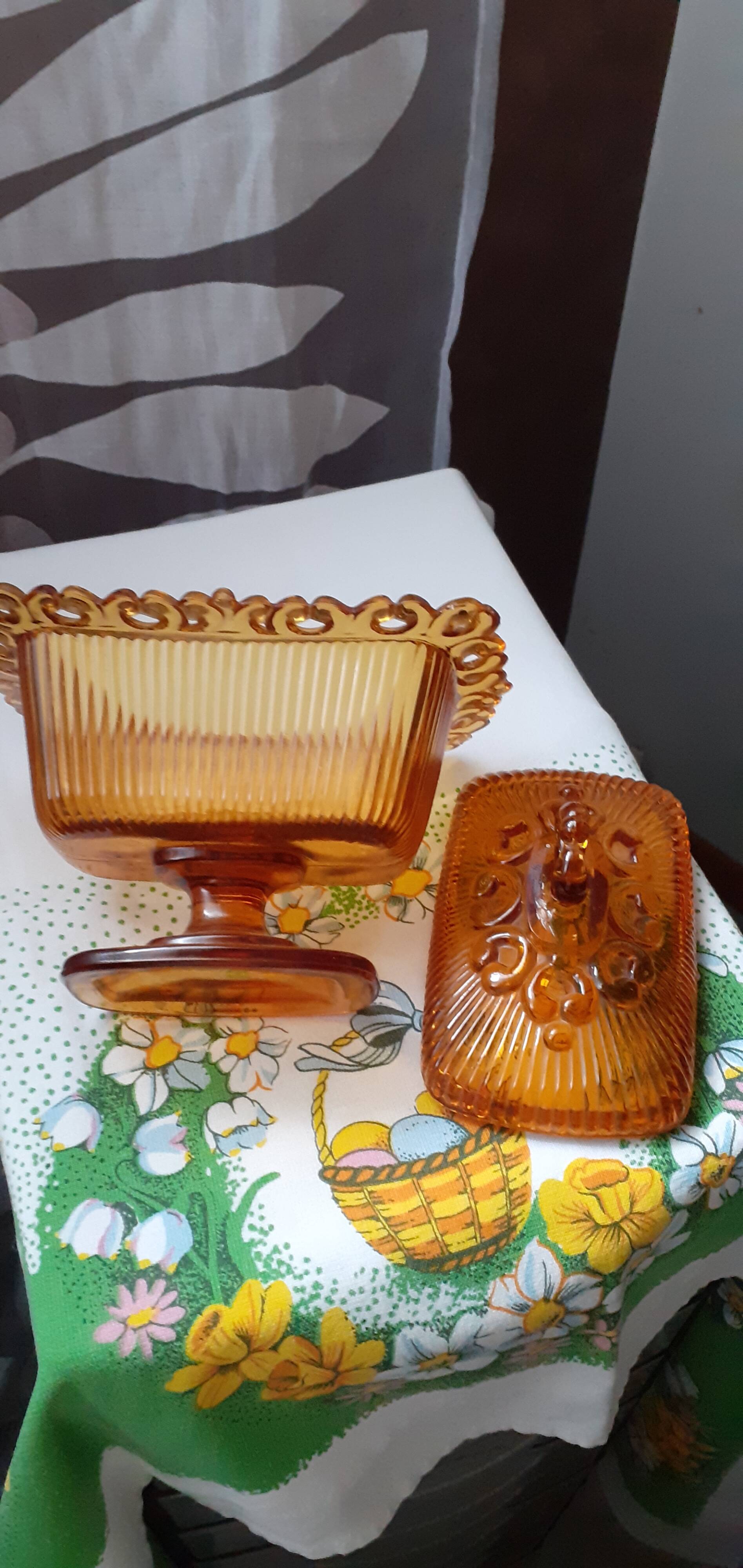 amber-colored pressed glass butter dish