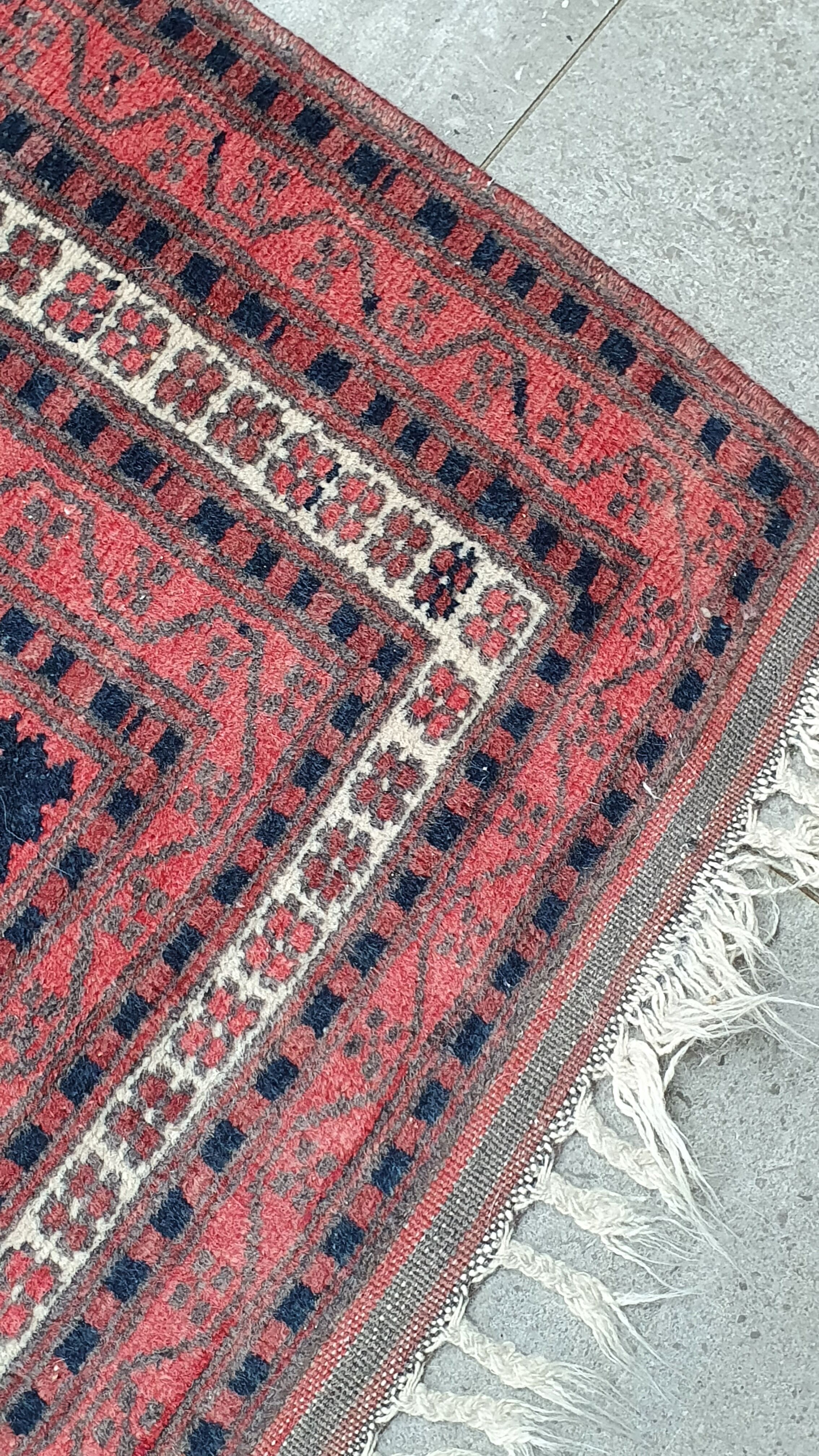 Old hand-knotted wool carpet