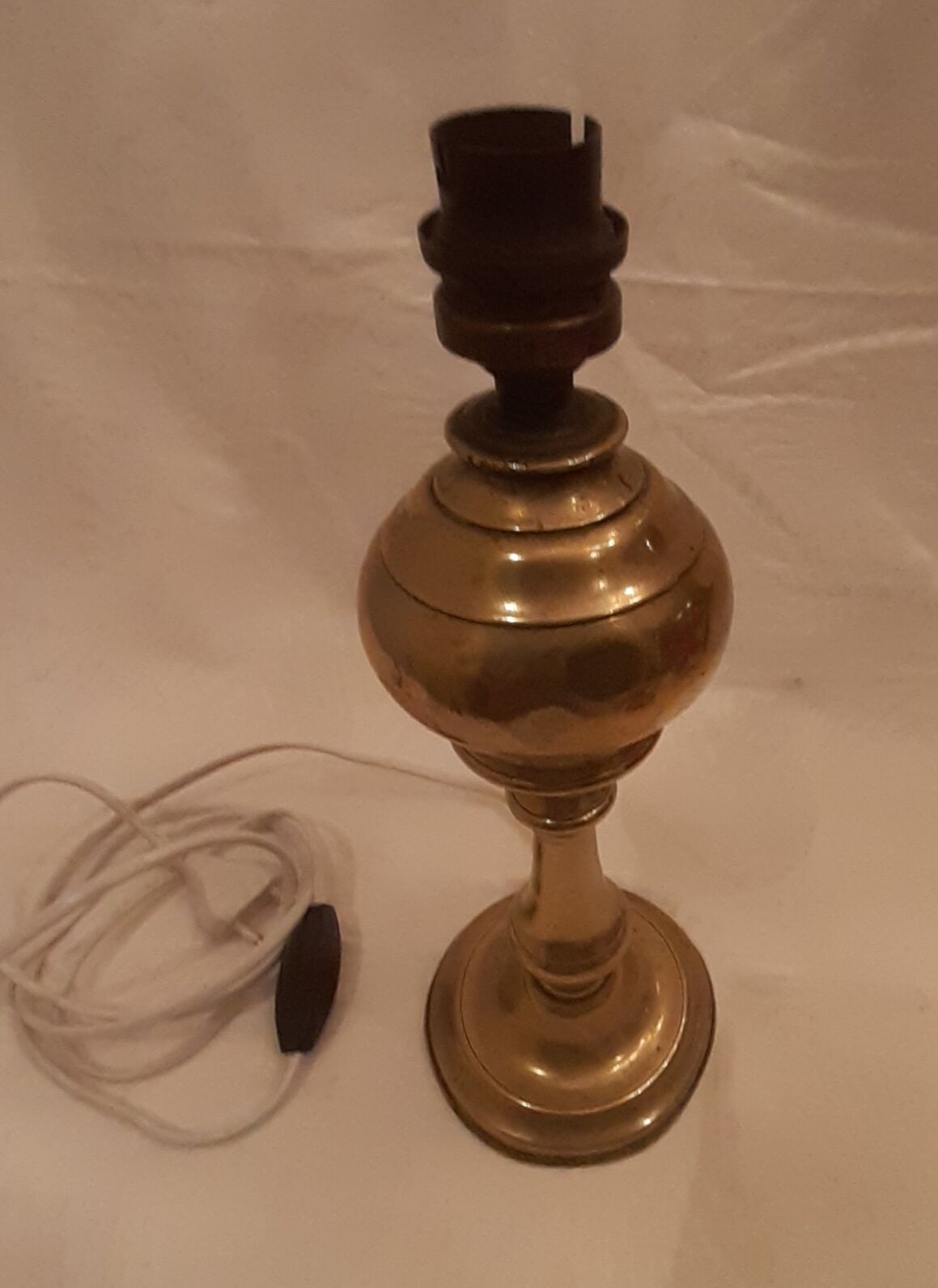 Old lamp foot in electrified brass