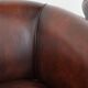 Set of two cow leather club armchairs in a luxurious red/brown colour