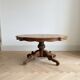 Oval coffee table in walnut burl wood.