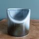 Vase Virebent porcelain cylindrical roll shape with a deep neck.